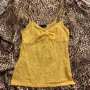 Sexy tank top with bling buttons.